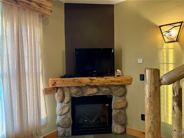 room details with a fireplace and a textured ceiling