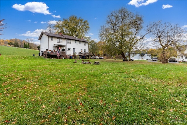 view of yard with a wooden deck