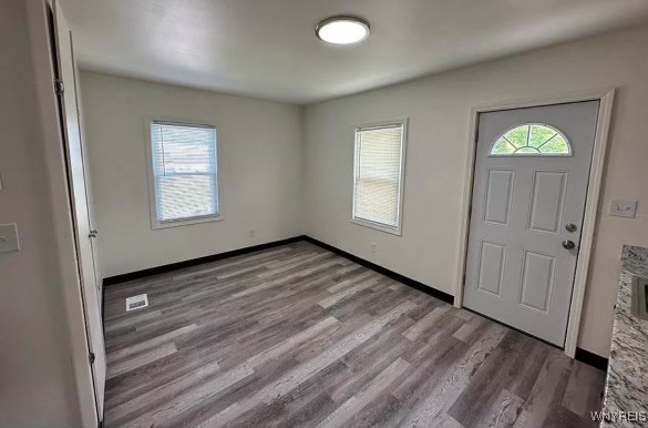 foyer entrance with light hardwood / wood-style floors