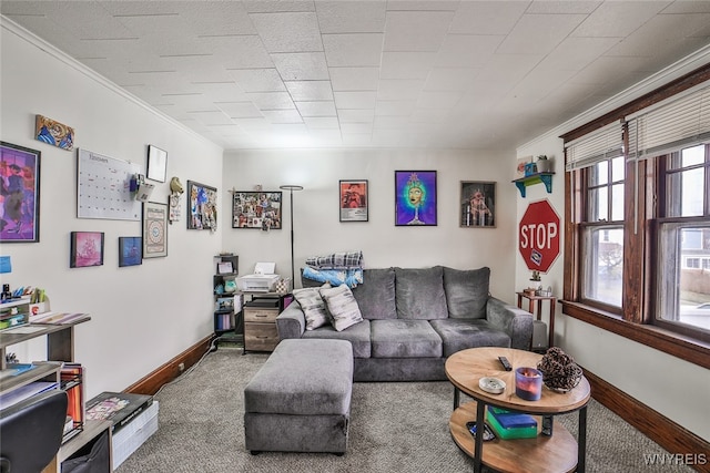 carpeted living room featuring ornamental molding