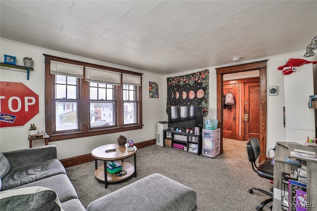 carpeted living room featuring ornamental molding