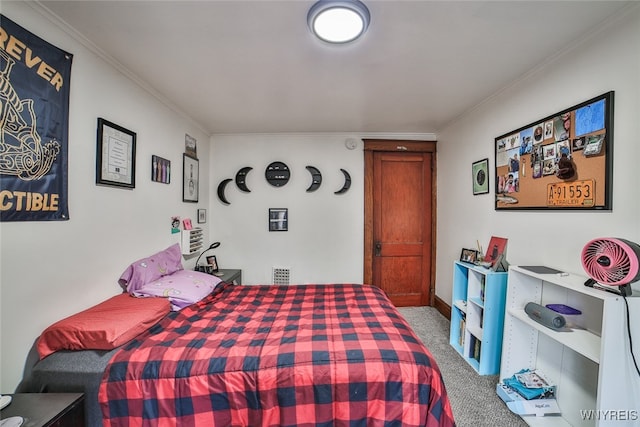 carpeted bedroom with crown molding