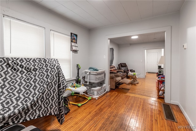 interior space with wood-type flooring and a healthy amount of sunlight