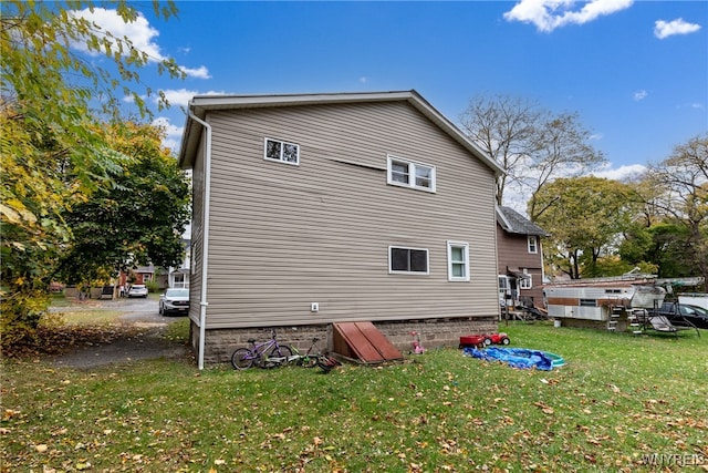 view of property exterior featuring a yard