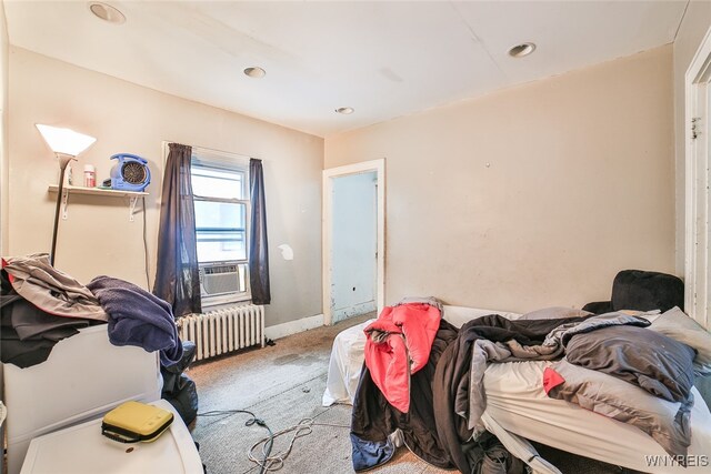 carpeted bedroom with radiator