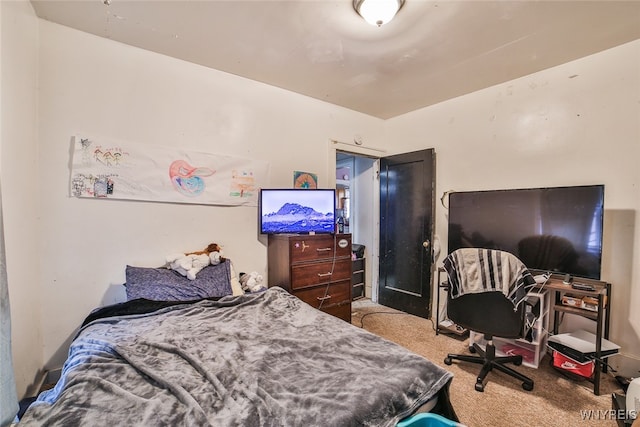 bedroom featuring light carpet