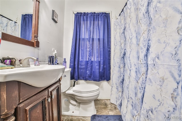 bathroom featuring toilet, vanity, tile patterned floors, and a shower with curtain