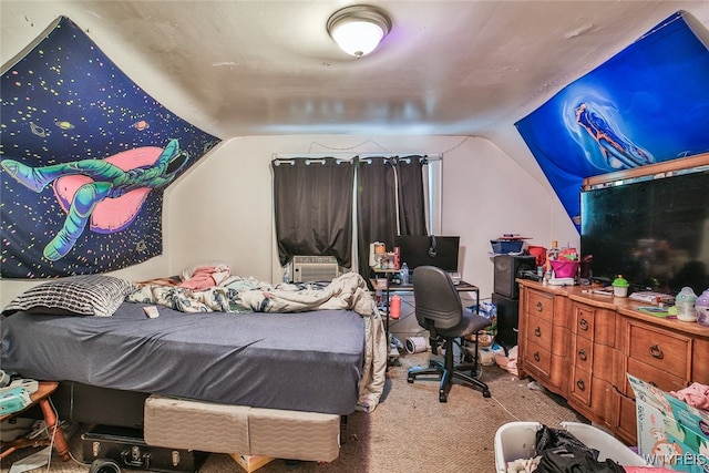 bedroom with light colored carpet and lofted ceiling