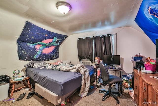 bedroom featuring lofted ceiling and carpet flooring