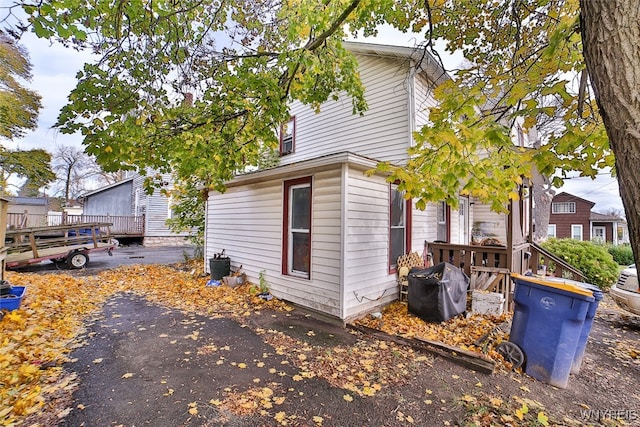 view of side of home with a deck