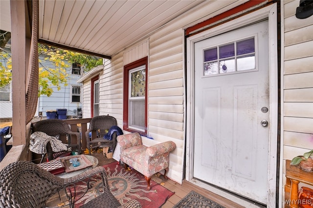 property entrance featuring covered porch