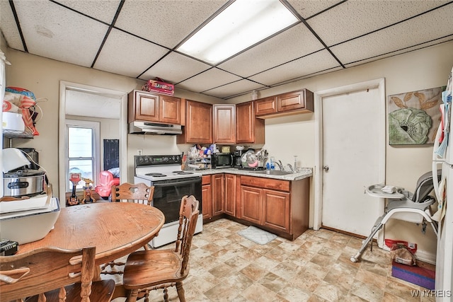 kitchen with a paneled ceiling, sink, and white electric range oven