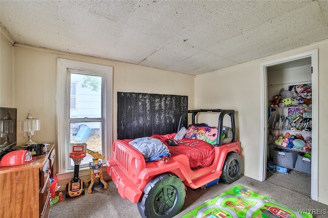 bedroom featuring a closet and carpet