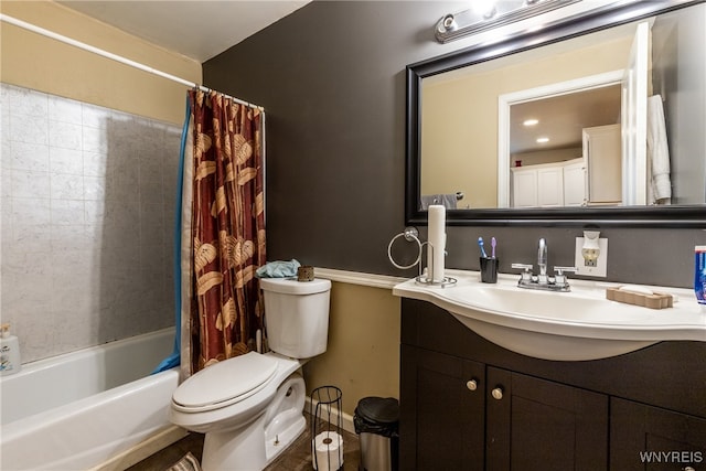 full bathroom featuring shower / tub combo with curtain, vanity, and toilet