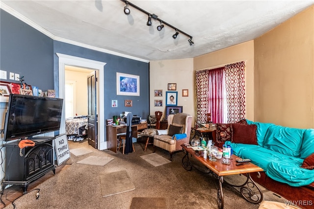 living room with carpet, rail lighting, and crown molding