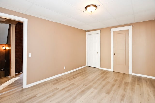 unfurnished bedroom featuring light wood-type flooring