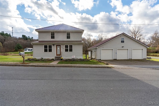 view of front of house with an outbuilding and a garage