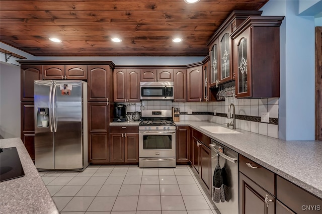 kitchen featuring appliances with stainless steel finishes, sink, dark brown cabinets, and wood ceiling