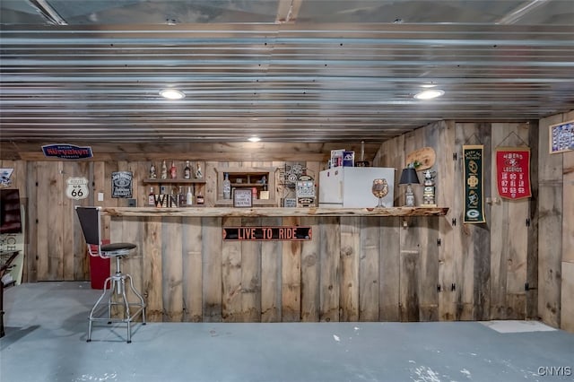 basement with white refrigerator