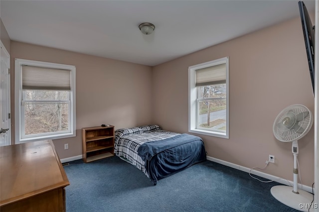 bedroom with dark carpet