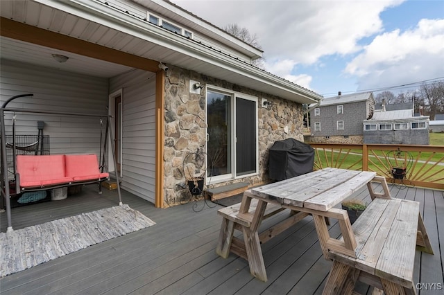 wooden deck with grilling area