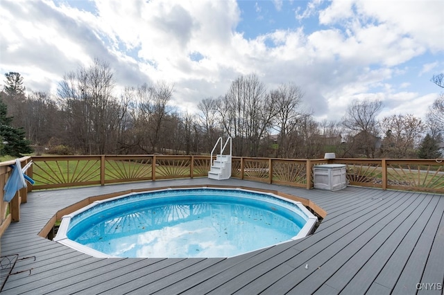 view of pool with a wooden deck