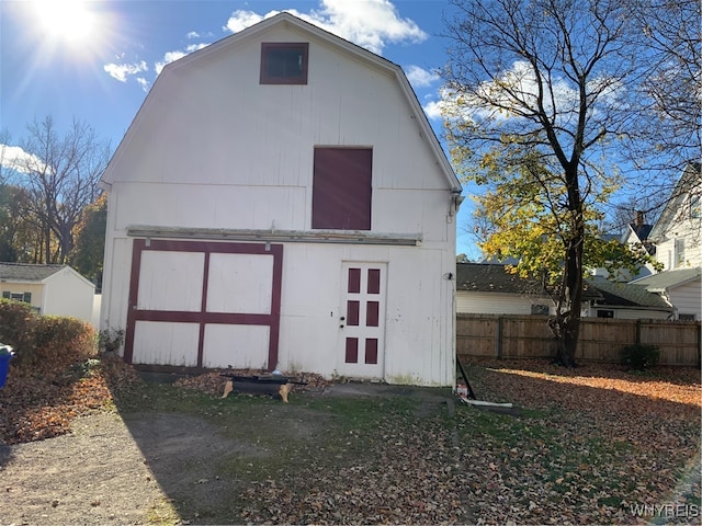 rear view of house with an outdoor structure