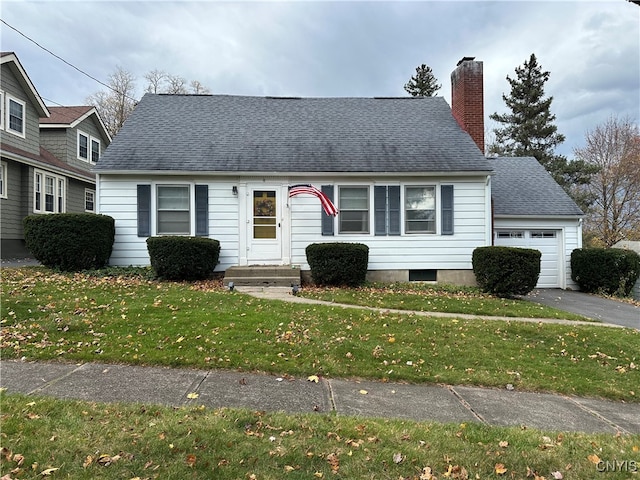 view of front of house with a garage and a front yard