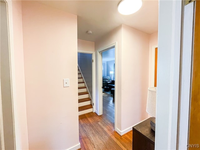 hall with hardwood / wood-style floors