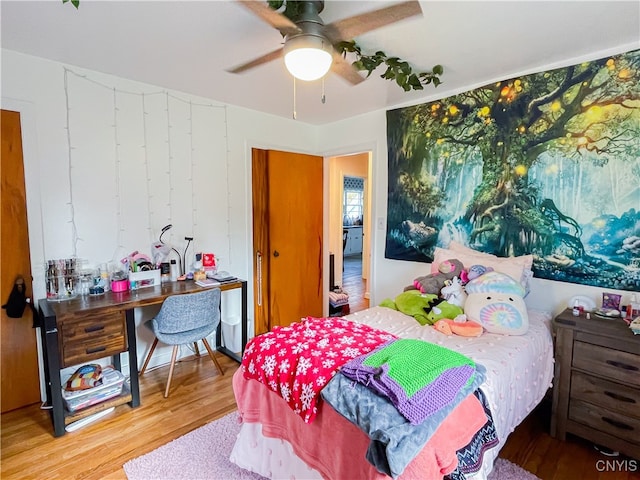 bedroom featuring wood-type flooring and ceiling fan