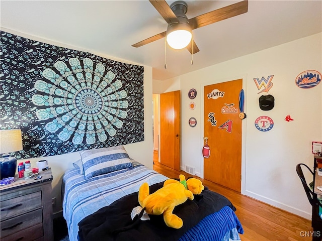 bedroom featuring ceiling fan and light wood-type flooring