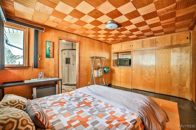 bedroom with wood walls, wooden ceiling, and a closet