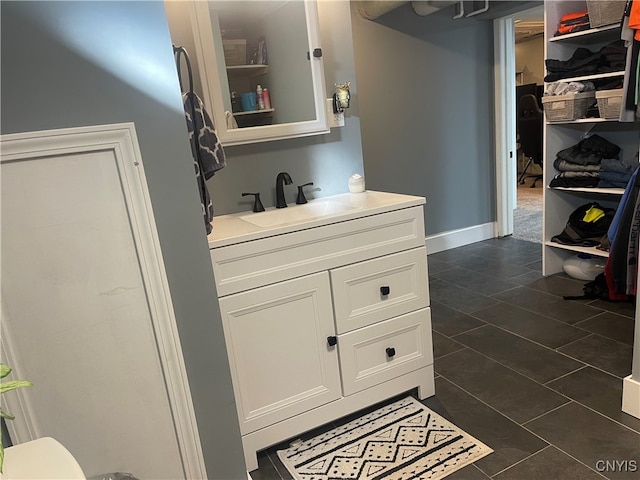 bathroom with vanity and tile patterned floors