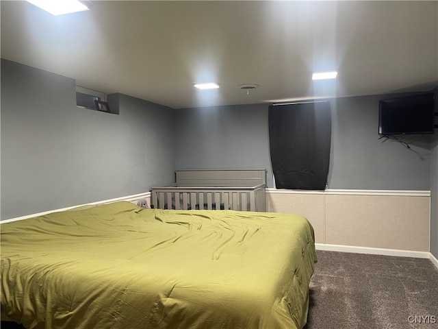 bedroom featuring dark colored carpet