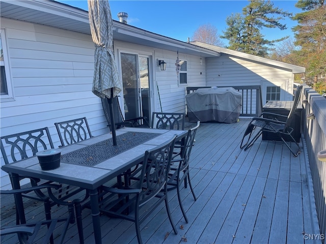 wooden terrace with area for grilling