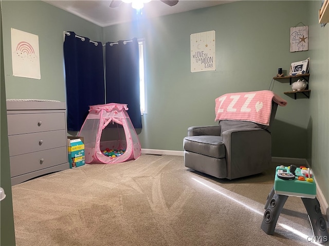 recreation room with ceiling fan and carpet floors