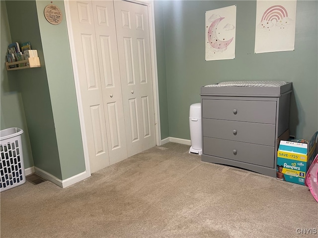 carpeted bedroom with a closet