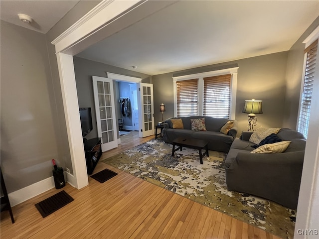 living room featuring french doors and wood-type flooring