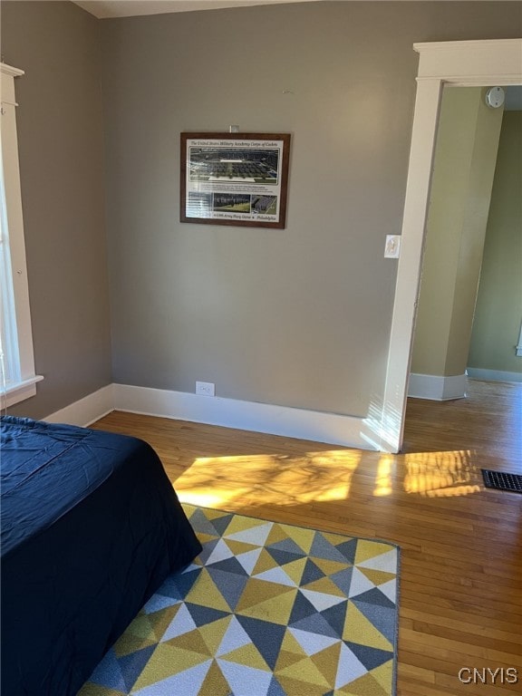 bedroom featuring wood-type flooring