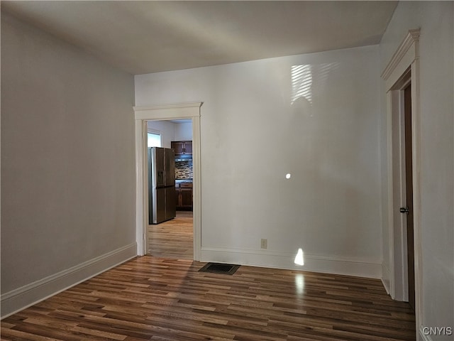 empty room featuring dark hardwood / wood-style floors