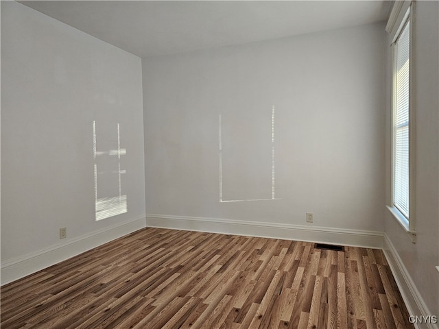 empty room featuring hardwood / wood-style flooring