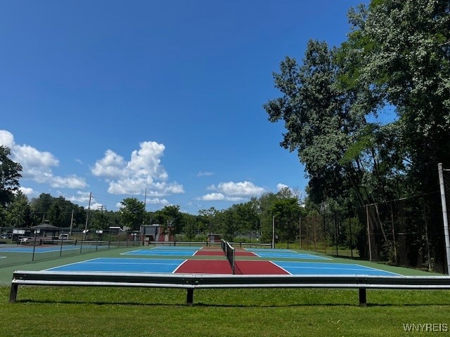 view of basketball court with a yard and tennis court