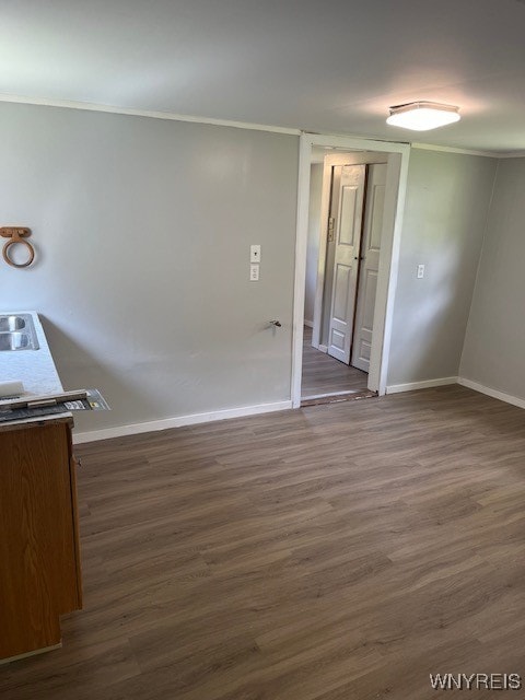 empty room with dark wood-type flooring