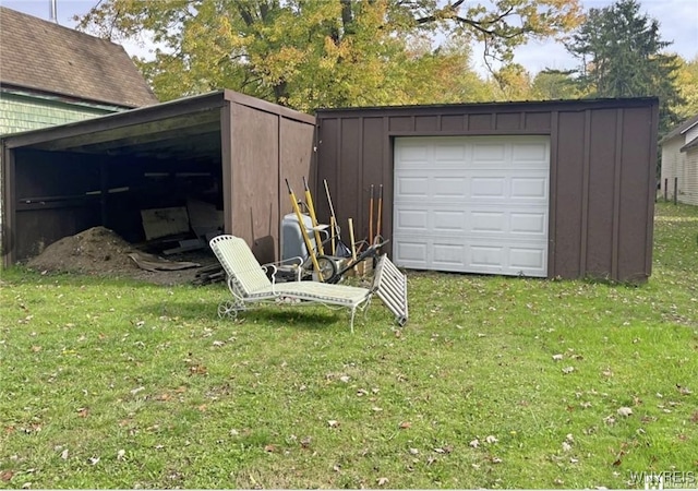 garage featuring a lawn