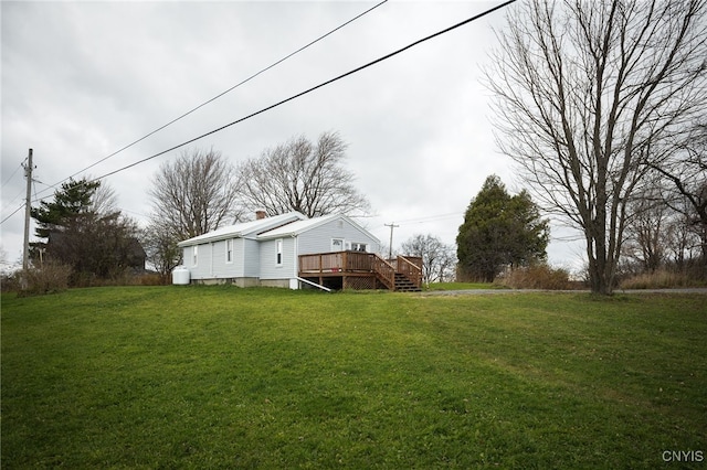 view of yard featuring a wooden deck