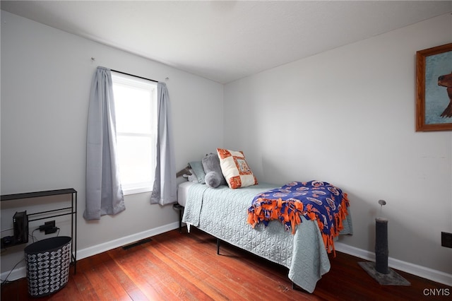 bedroom with hardwood / wood-style floors