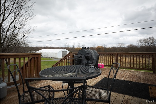 wooden terrace featuring grilling area