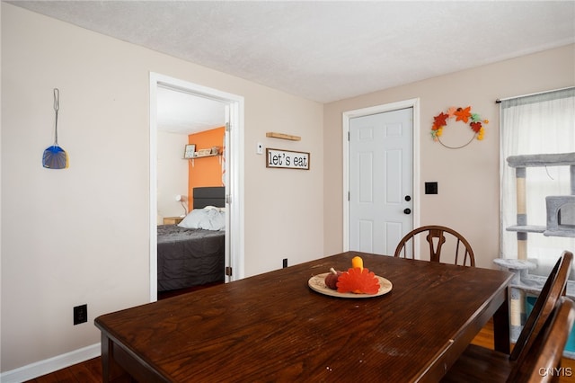 dining space with dark wood-type flooring