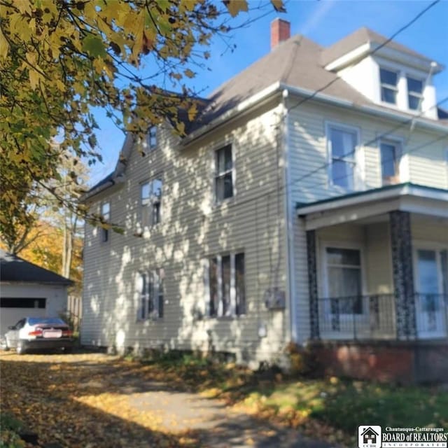 view of side of home featuring a garage