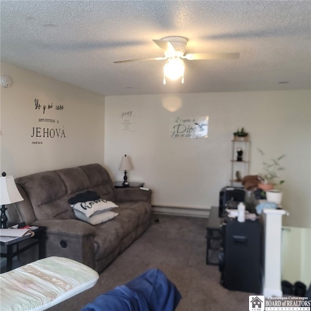 living area featuring carpet floors, a textured ceiling, baseboard heating, and a ceiling fan